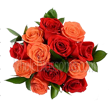 Radiating orange rose centerpiece with vivid blooms, ideal for weddings, bold gifts, and vibrant floral styling.