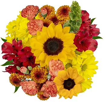 A lush sunflower centerpiece adds a pop of sunshine to a rustic wedding table setting.