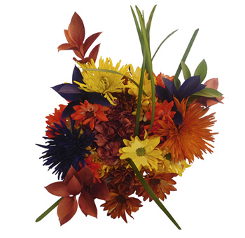 Vibrant fall wedding centerpieces with orange spider mums, ruscus, lily grass, and daisy poms from Whole Blossoms.