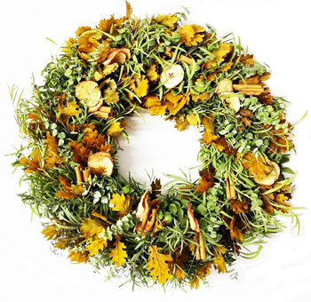 Applely Ever After Round Fall Wreath featuring dried apple slices, fragrant cinnamon sticks, golden foliage, and lush eucalyptus. Ideal for autumn decorations.