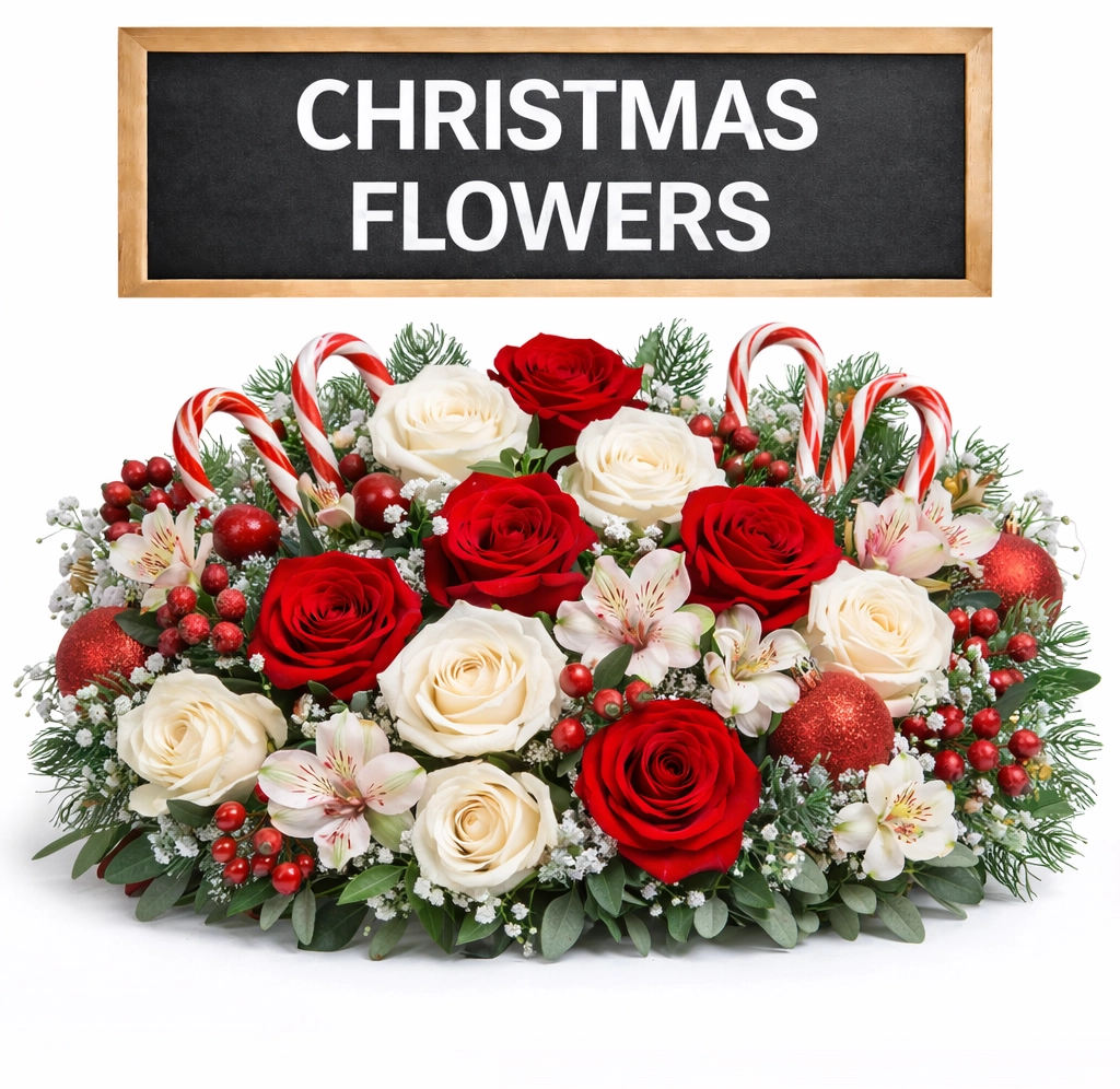 Christmas floral arrangement featuring fresh cut red roses and festive seasonal blooms for holiday decor, winter weddings, and celebrations.