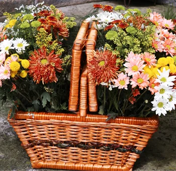 Vibrant fall poms and mums beautifully arranged with rich autumn colors, perfect for seasonal events and wedding decorations.