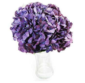 A Royal Purple Tinted Hydrangea Bouquet featuring rich, deep purple petals in a clear vase.