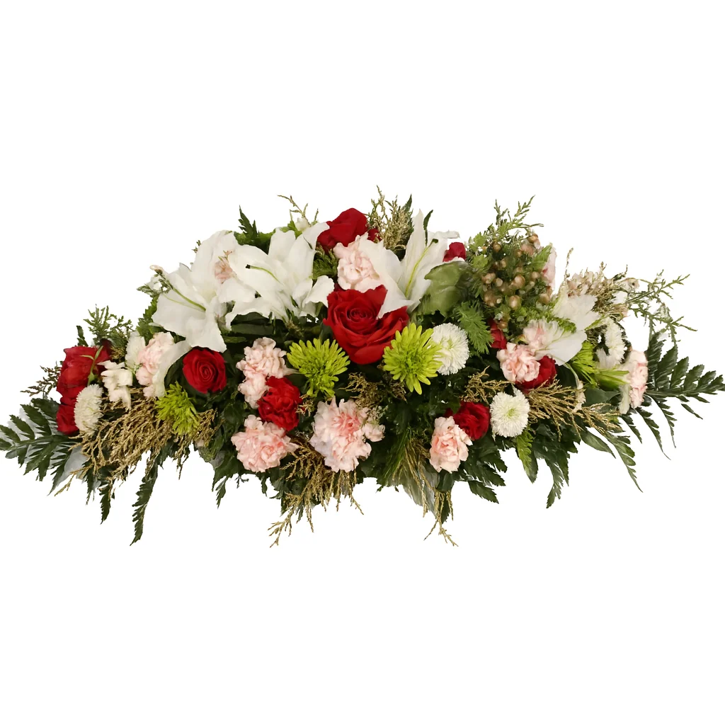 Elegant centerpiece with red roses, white lilies, pink carnations, green mums, and lush greenery arranged in a long cascading design.