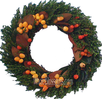 Berry Fall Wreath featuring lush greenery, orange and red berries, and brown magnolia leaves, perfect for autumn and Thanksgiving decorations.