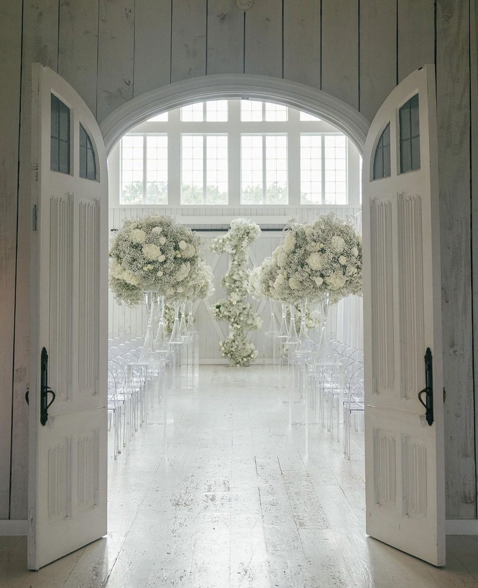 Ethereal entryway into wedding ceremony surrounded by bab's breath.