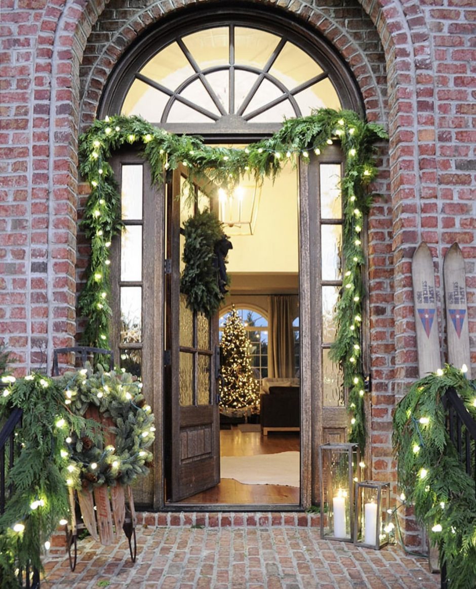 Nice entry to a home decorated with fresh garland.