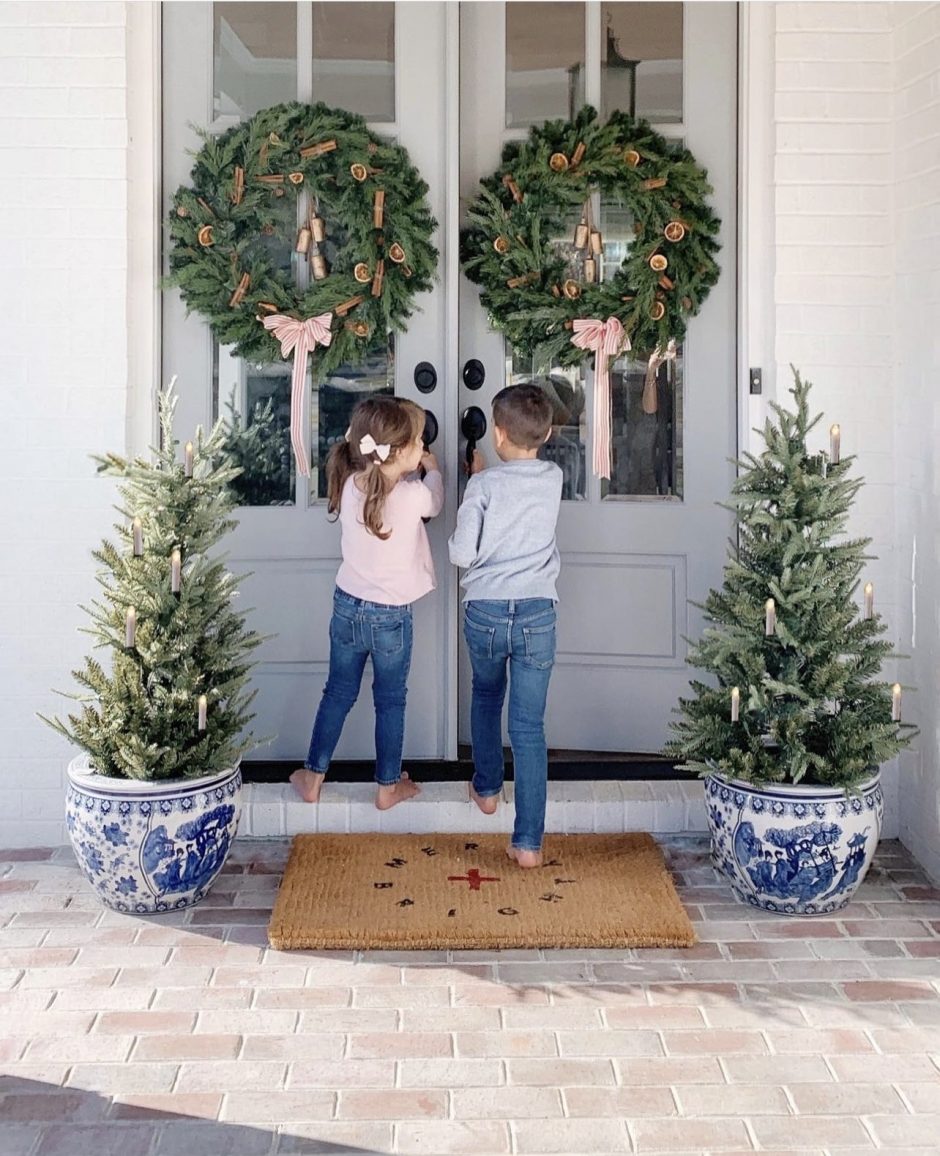 Holiday entryway decorated with fresh wreaths.
