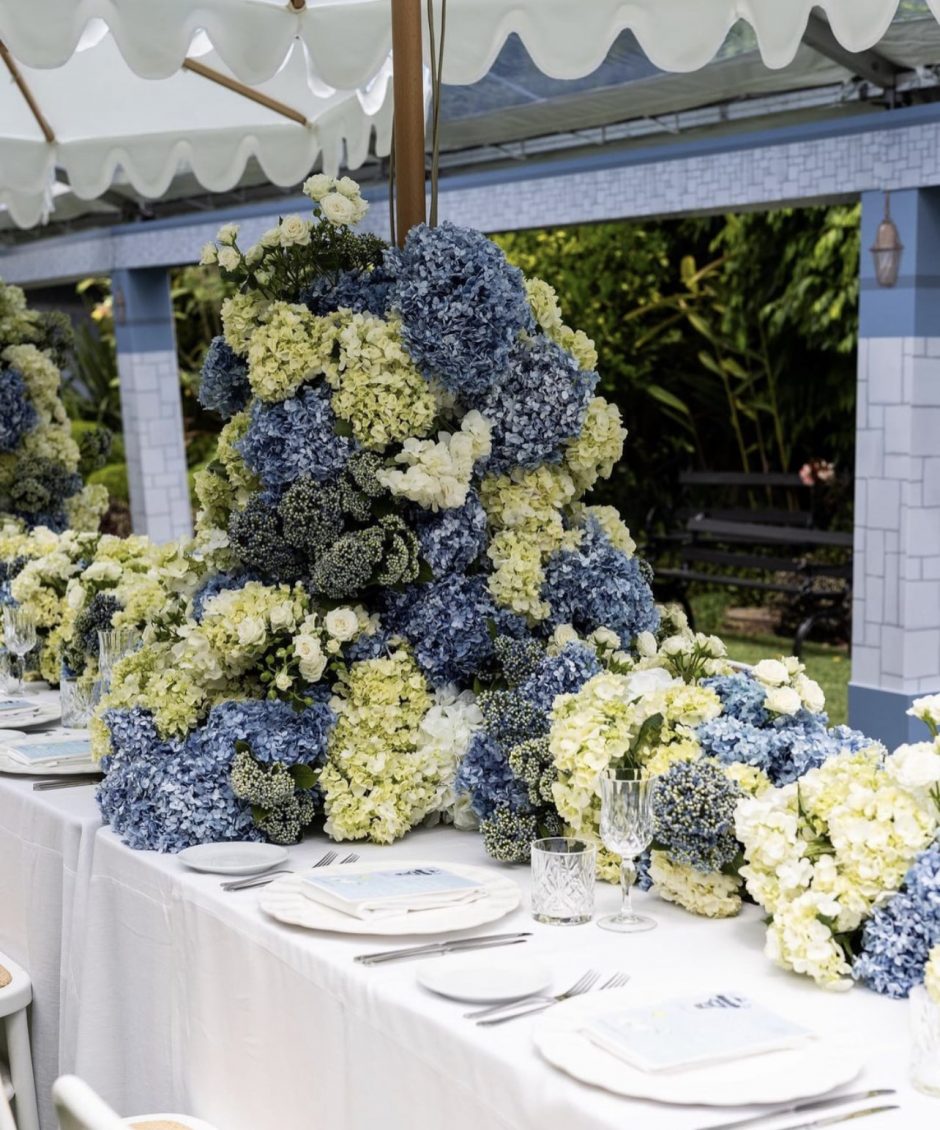 Wedding reception table with blue and green hydrangeas.