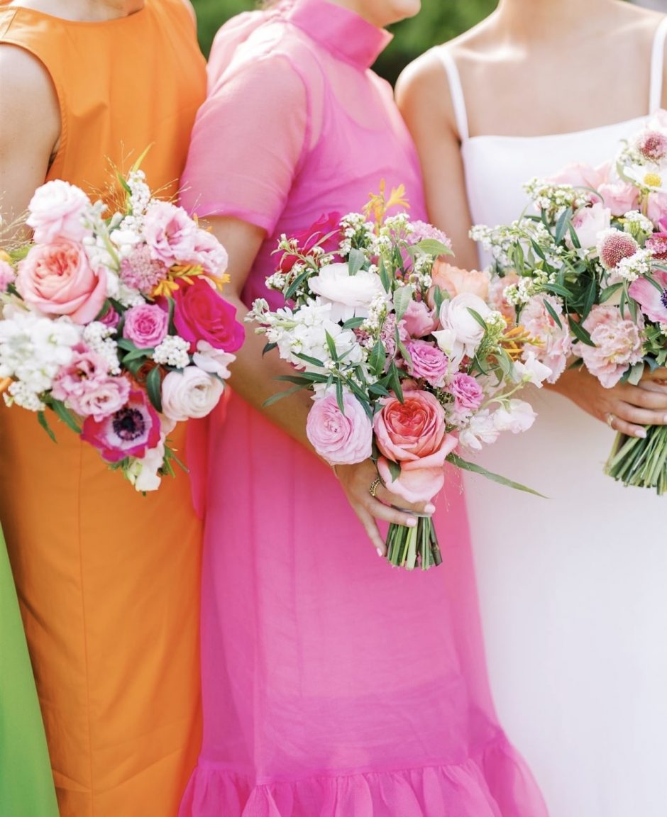 Bridal party with colorful bouquets.