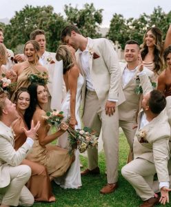 Newlywed couple with tropical wedding theme.