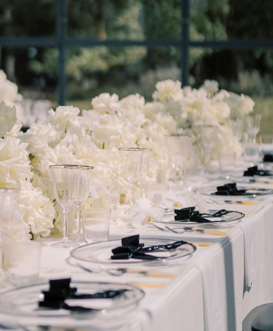 Wedding reception with white flowers and black accents.
