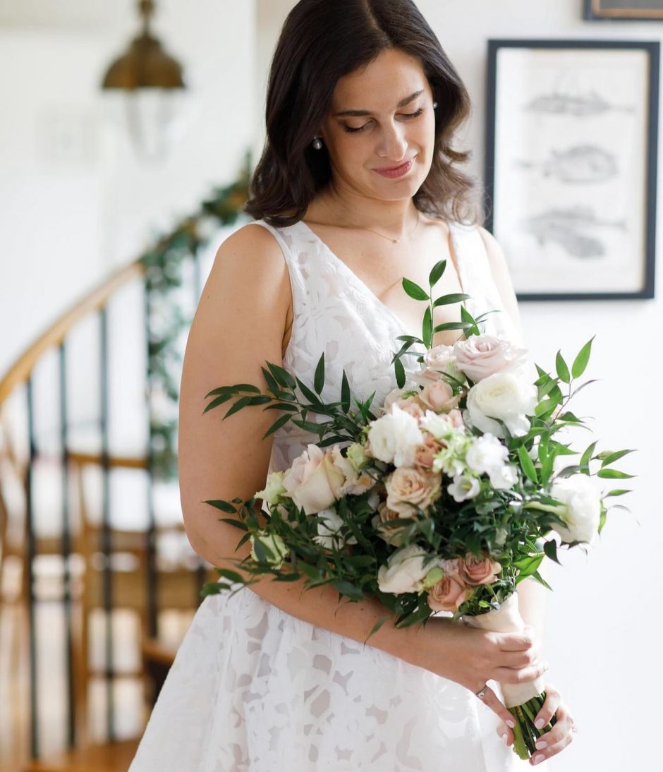 Wedding bouquet with pink, mocha, and white flowers.