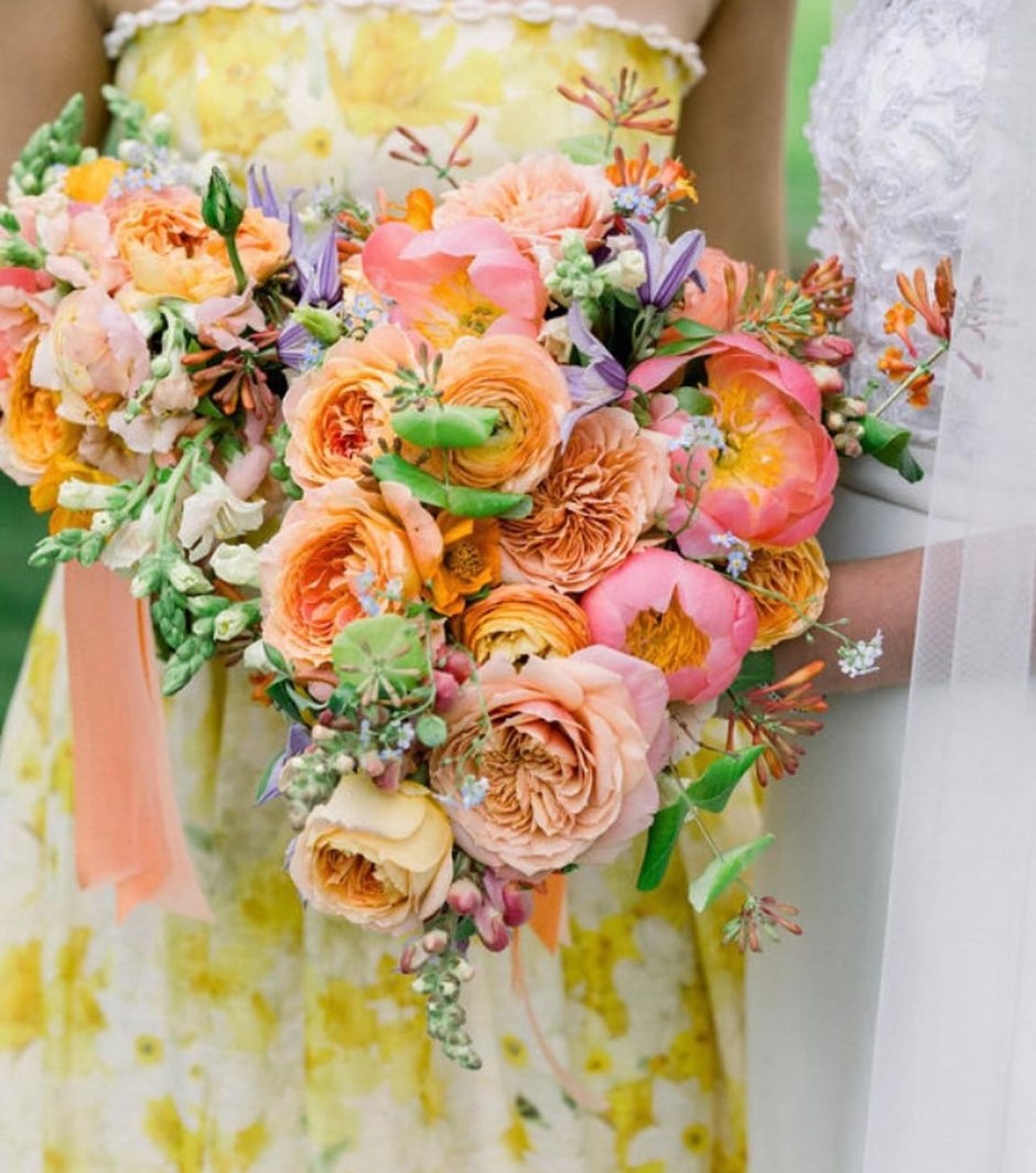 Bridal bouquet with peach and pink florals.