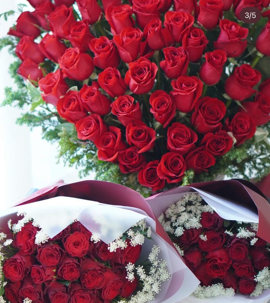 Red sweetheart roses and baby's breath.