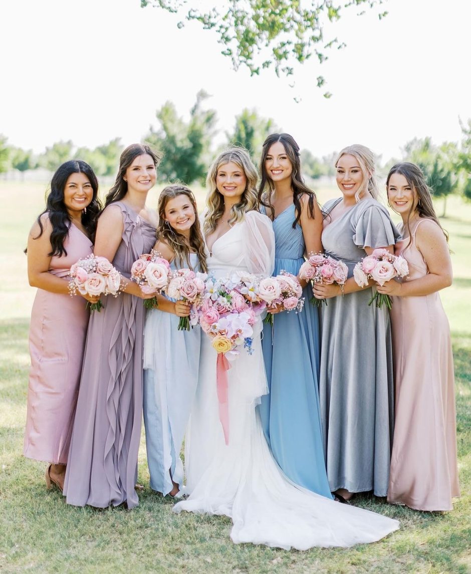 Bride and bridesmaids with pastel florals.