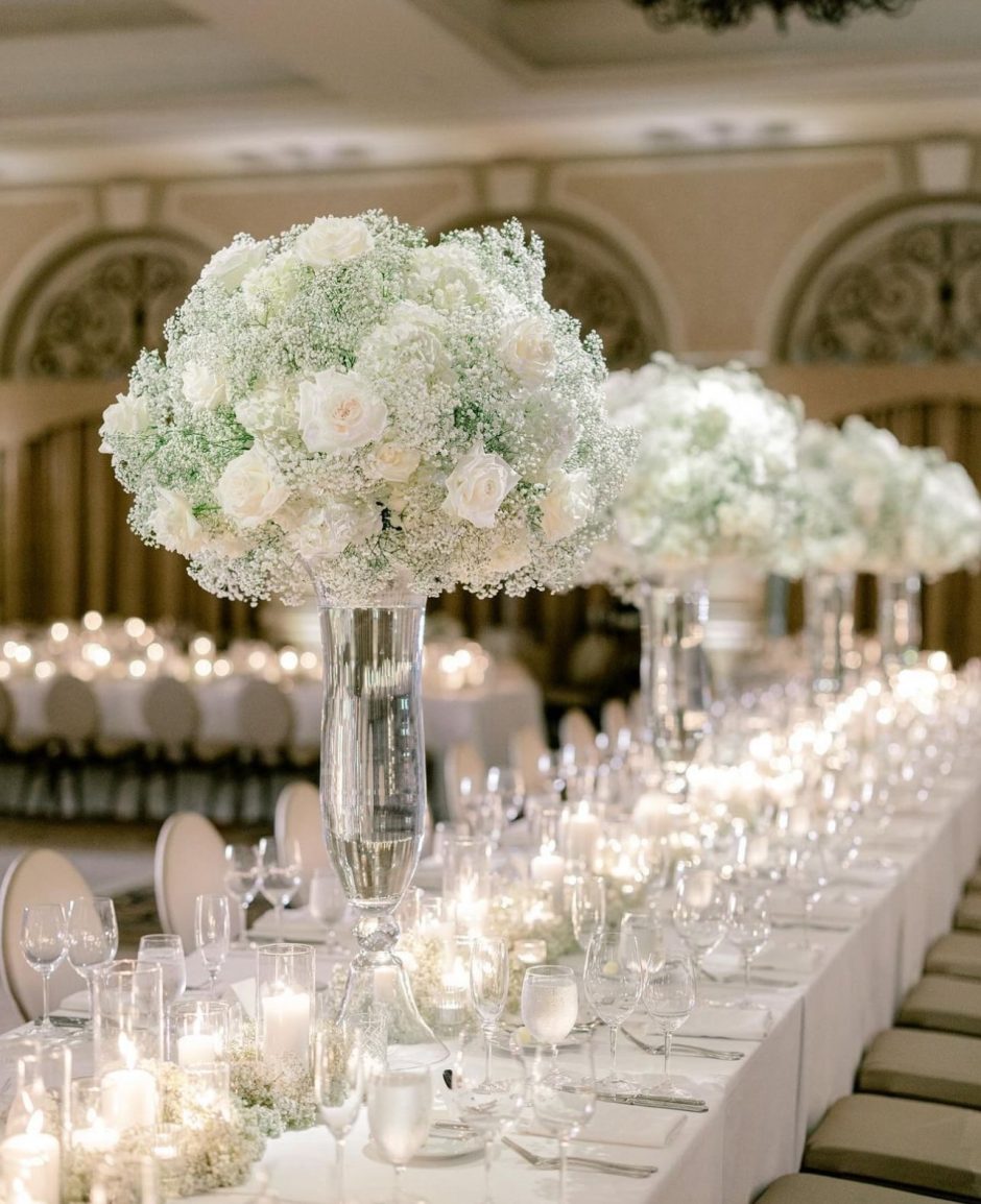 Wedding centerpieces with baby's breath and white flowers.