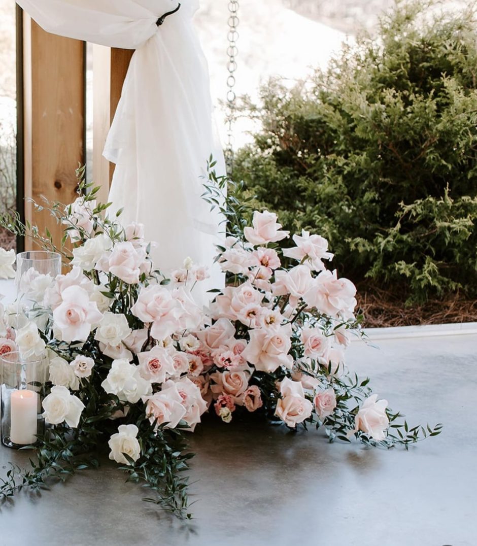 Ceremony installation with white and blush roses.