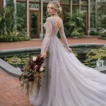 Baltic bride with burgundy wedding flowers at Tower Hill Botanic Garden conservatory.