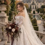 Polish bride holding a Chocolate Dahlia wedding bouquet at Oheka Castle in Huntington, New York
